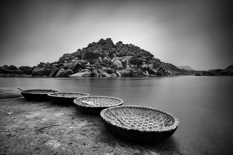 Coracles waiting for a ride in Hampi, Karnataka