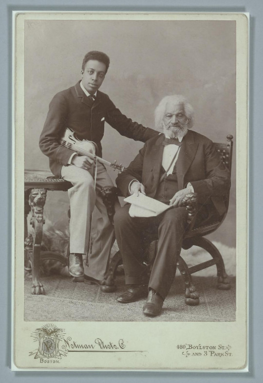 Cabinet card photograph of Frederick Douglass with his grandson Joseph Douglass