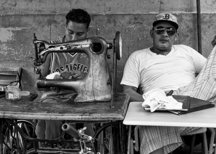 Nicaraguan men sewing