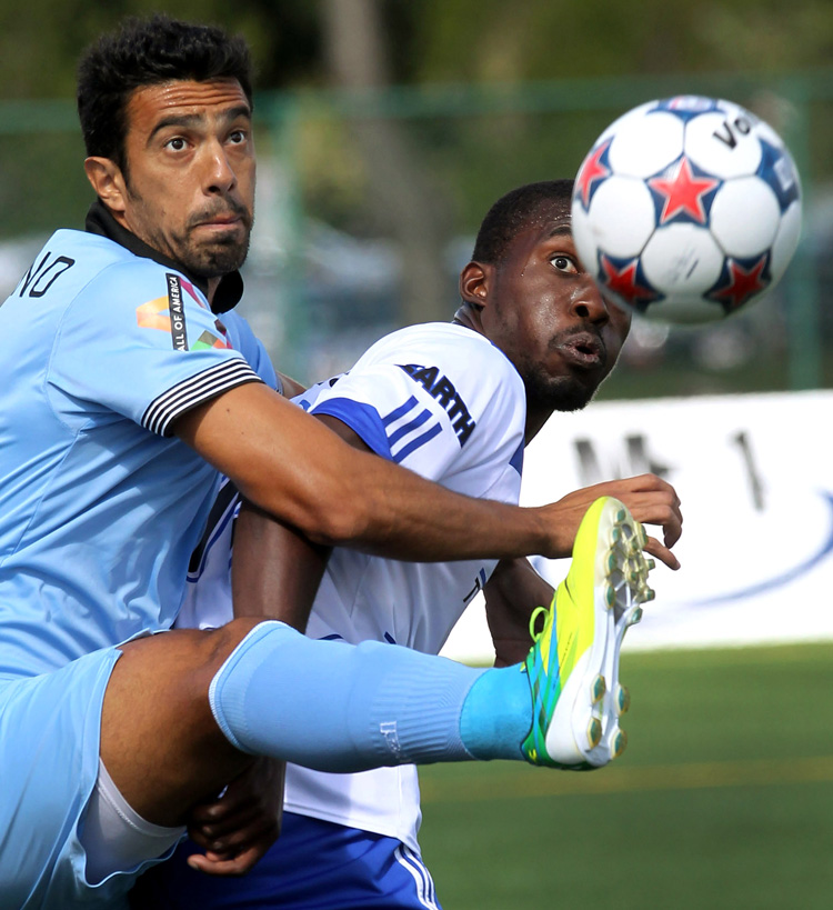 Soccer players captured while about to intercept the ball