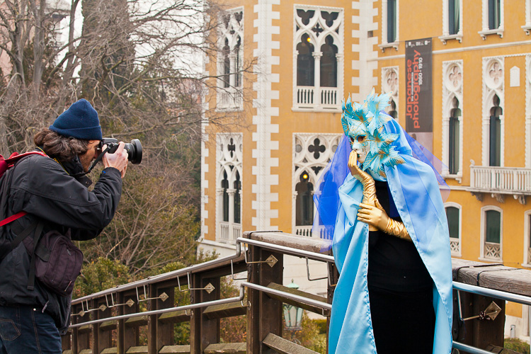 man photographing a model in Venice Italy - beginner photographer tips