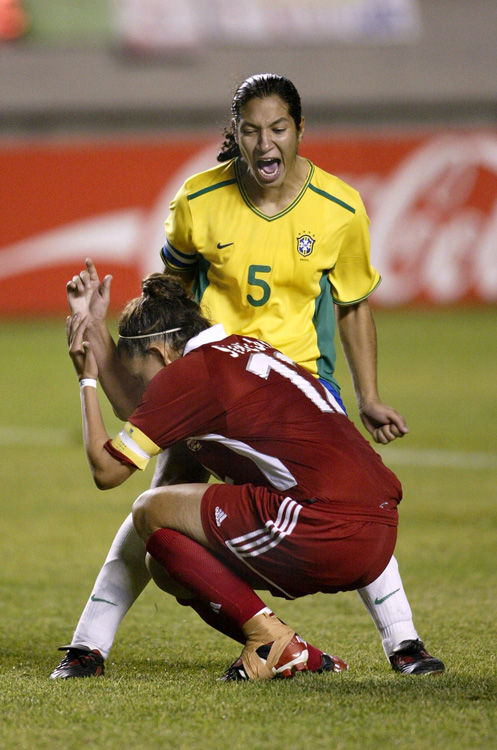 two women soccer players excited after a play