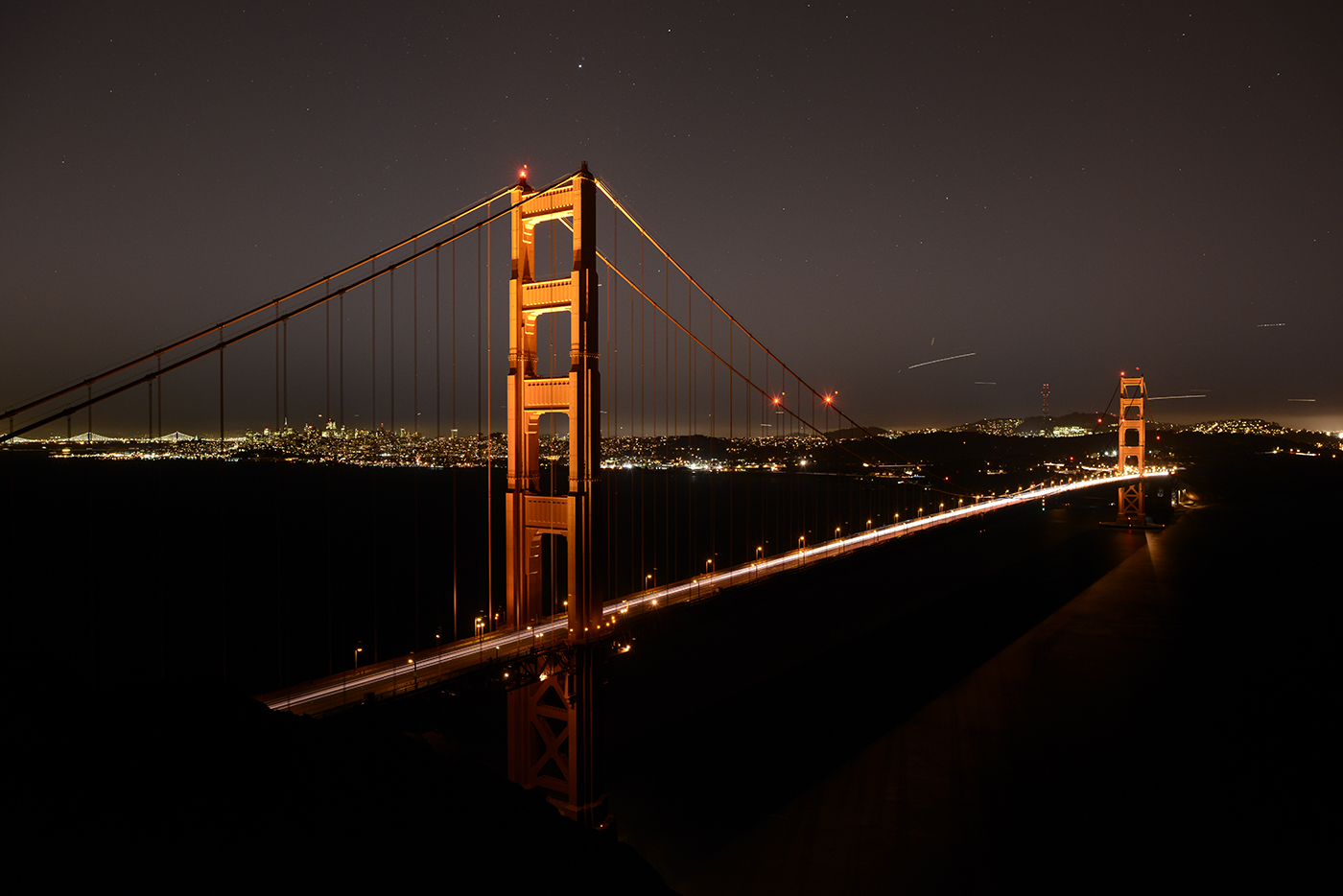 One exposure from the series.  Note all the air traffic to clean up!  I was also using a graduated ND filter to hold back the city, allowing for a longer sky exposure, in this example.