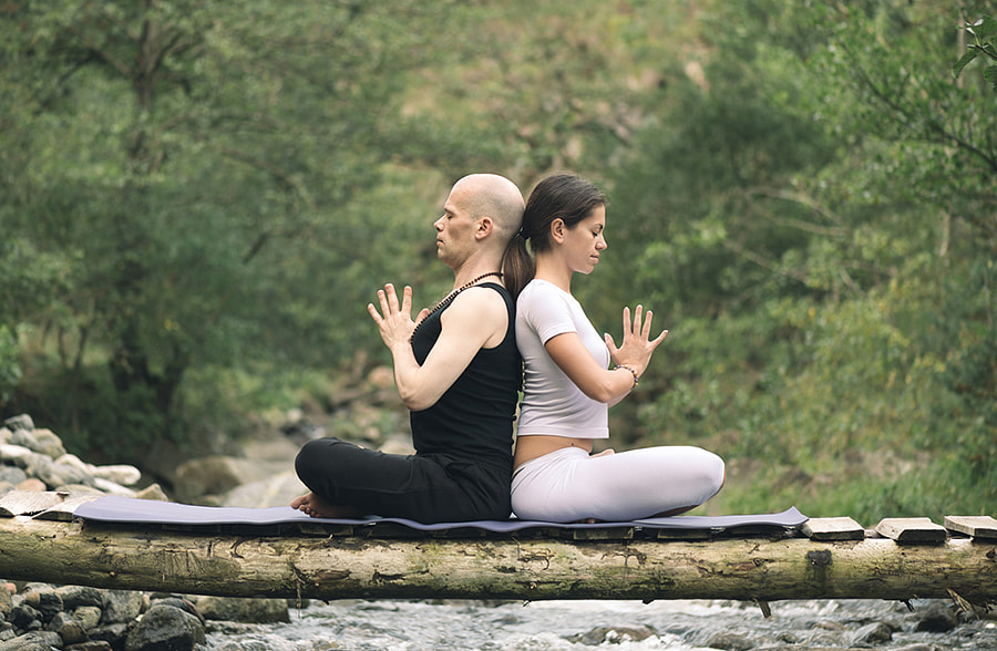 Woman and man doing yoga by Igor  Milic on 500px.com