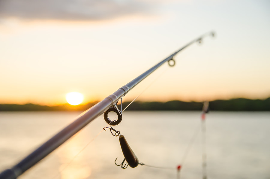 fishing on a lake before sunset by alex grichenko on 500px.com