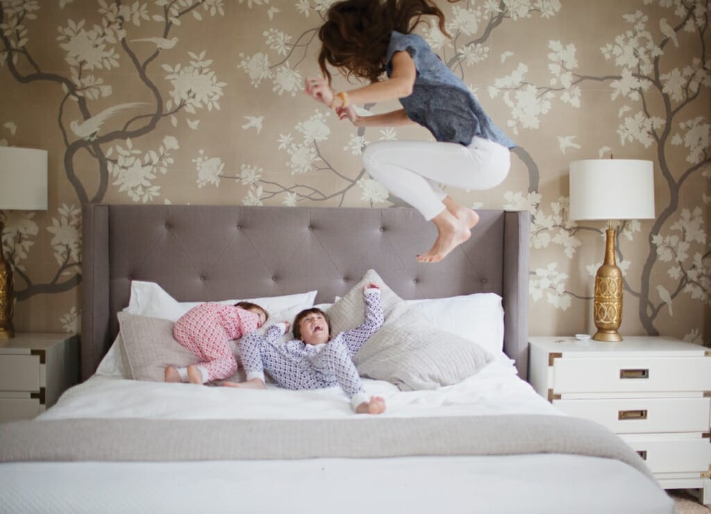 kids on bed laughing lifestyle photography