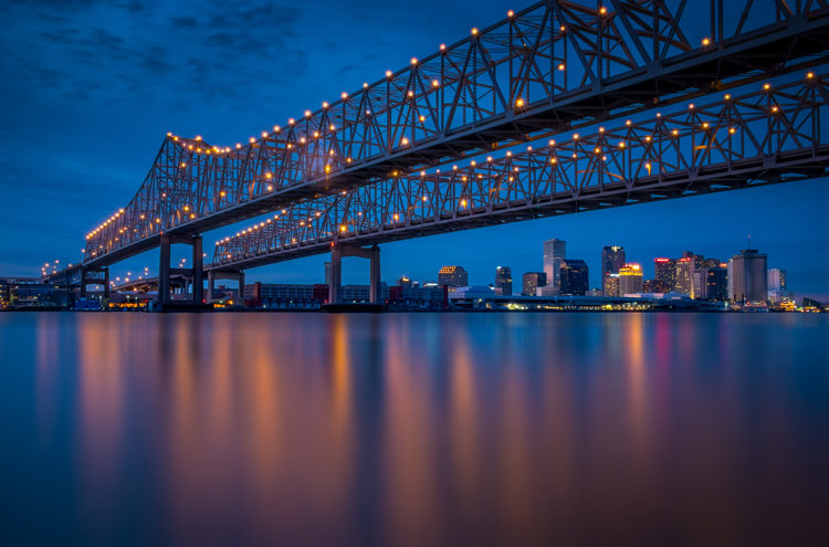 An example of a long exposure technique that stills the water under a bridge at night