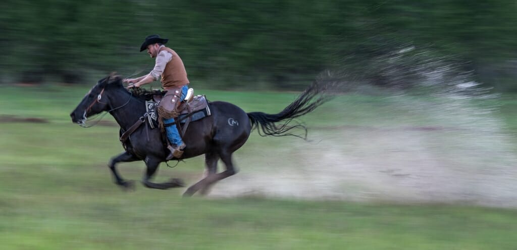 Running horse with rider