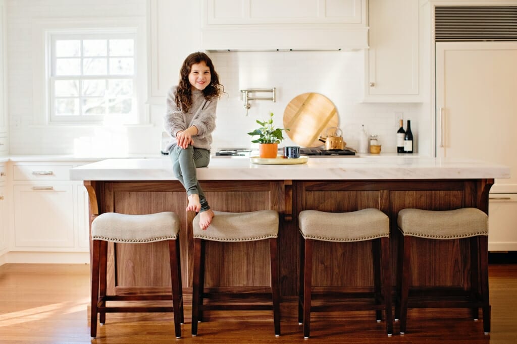 girl sitting on counter