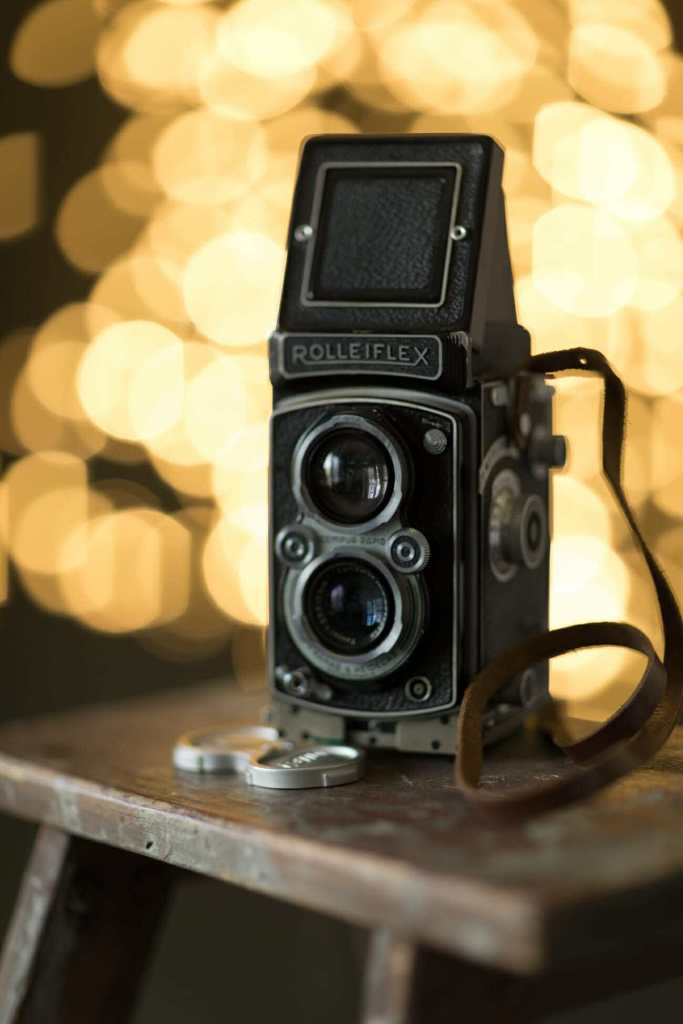 An Rolleiflex camera against a beautiful bokeh background