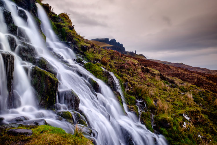 a long exposure and shutter speed blurs the water in the waterfall