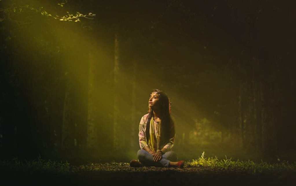 woman in forest dark
