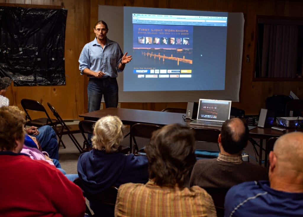 photographer teaching a photo workshop indoors