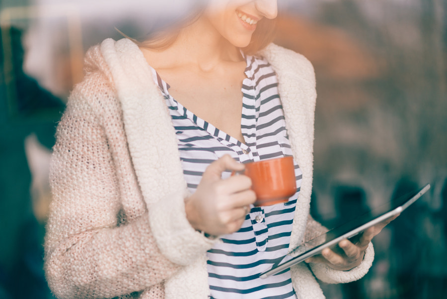 businesswoman using a digital tablet at her office by Igor  Milic on 500px.com