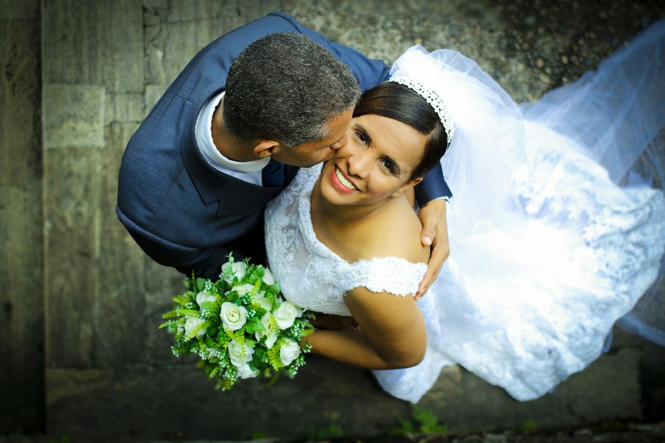 A groom kisses a bride, shot from above, another one of the classic wedding poses