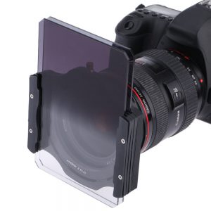 A square ND filter attached to the front of a DSLR lens