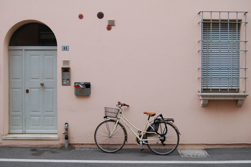 A bike leaning against a wall