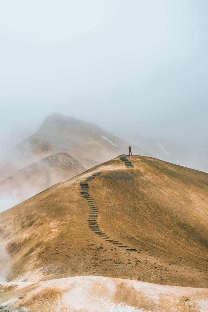 A landscape photo of a rugged mountain area with many leading lines.