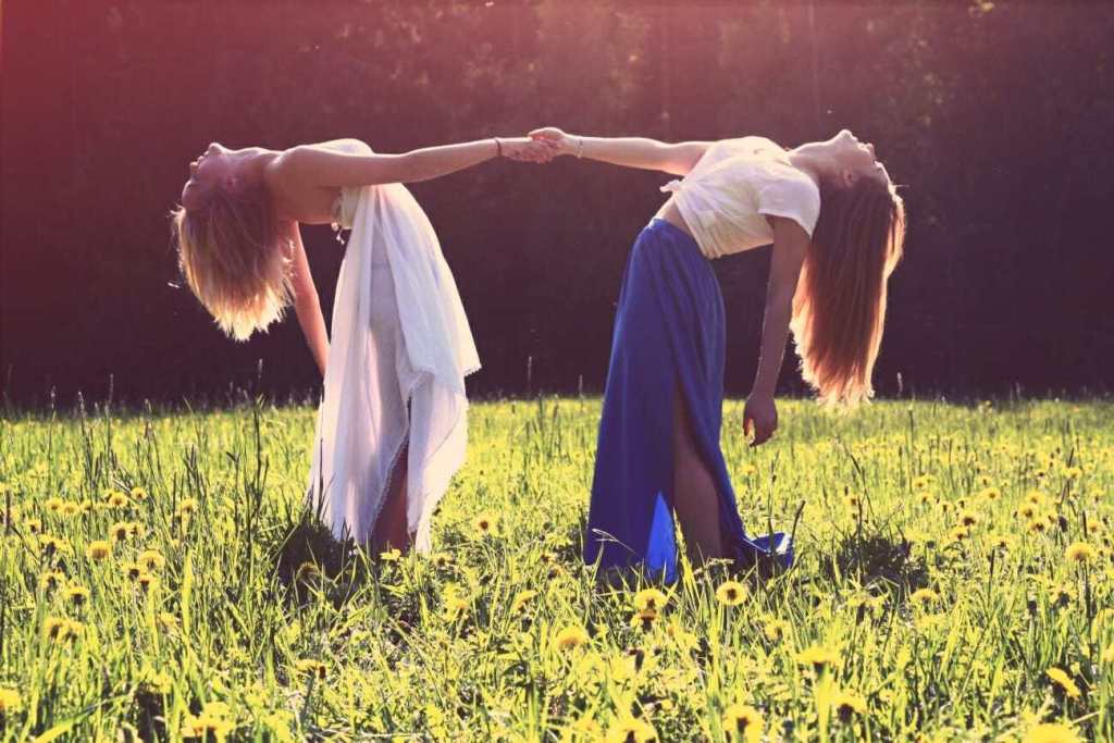 Two girls holding hands in a portrait photo