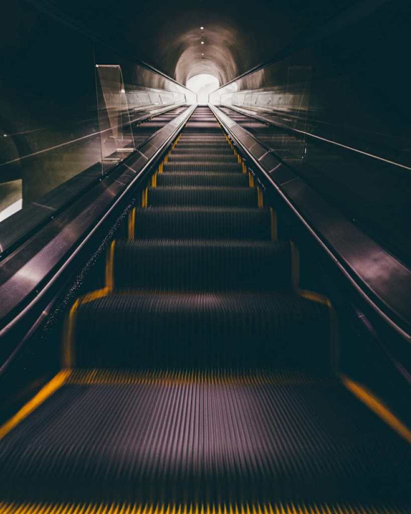 A shot of an escalator in a subway line