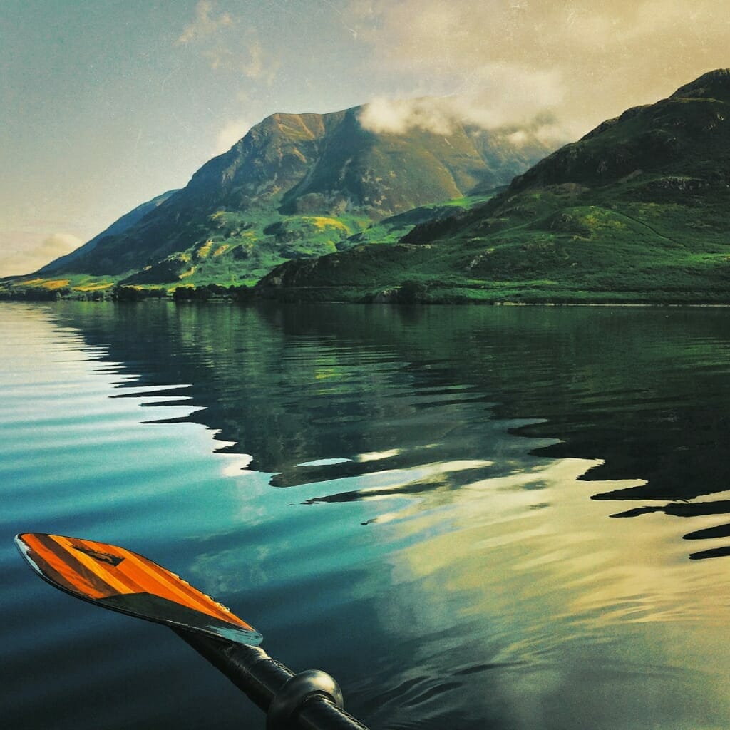 A mobile photography image of a lake and mountains, shot on an iPhone