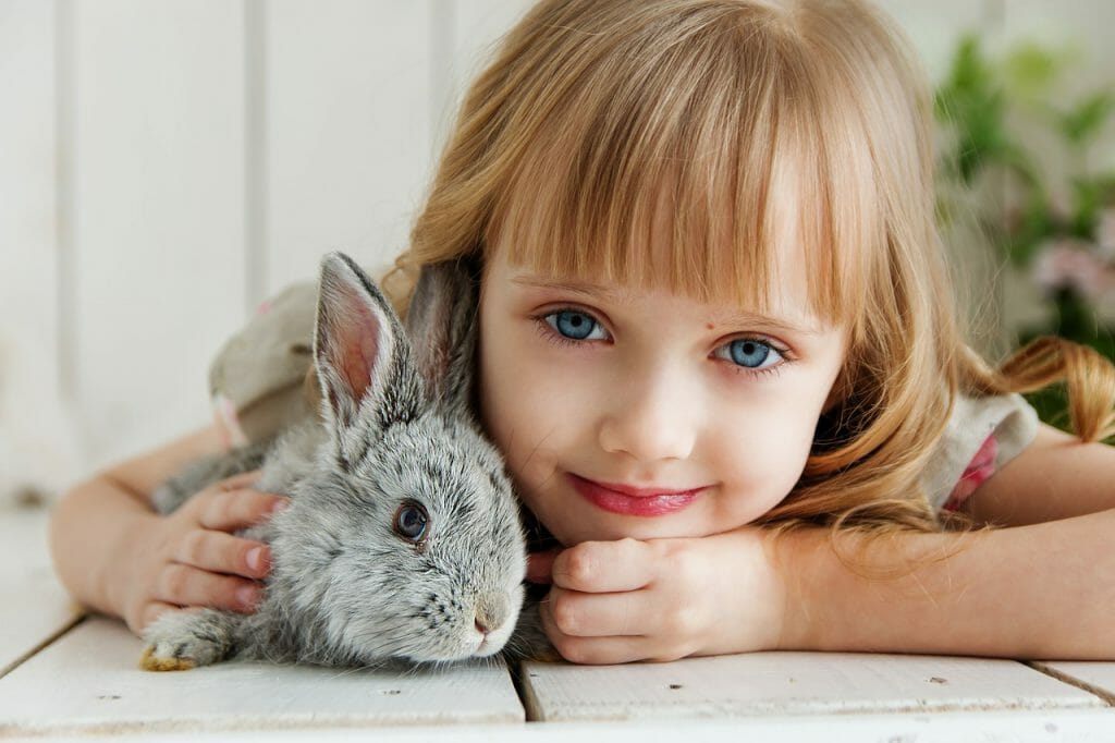 a girl cuddling with her rabbit