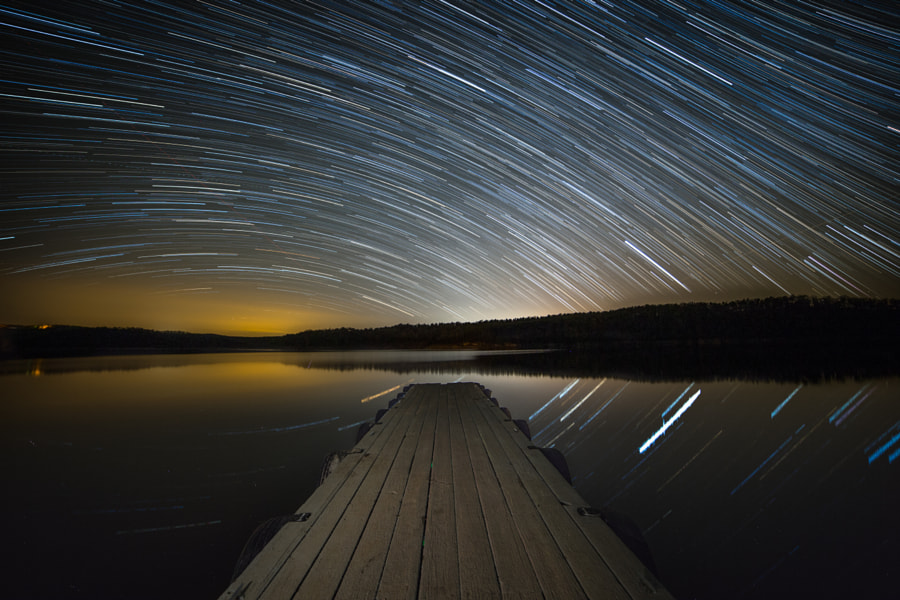 Startrails over the lake. by Benjamin King on 500px.com