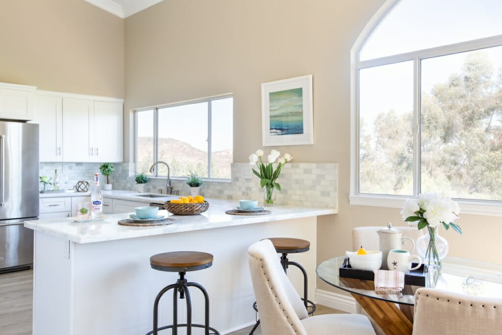 An interior photography image of a spacious kitchen and dining room