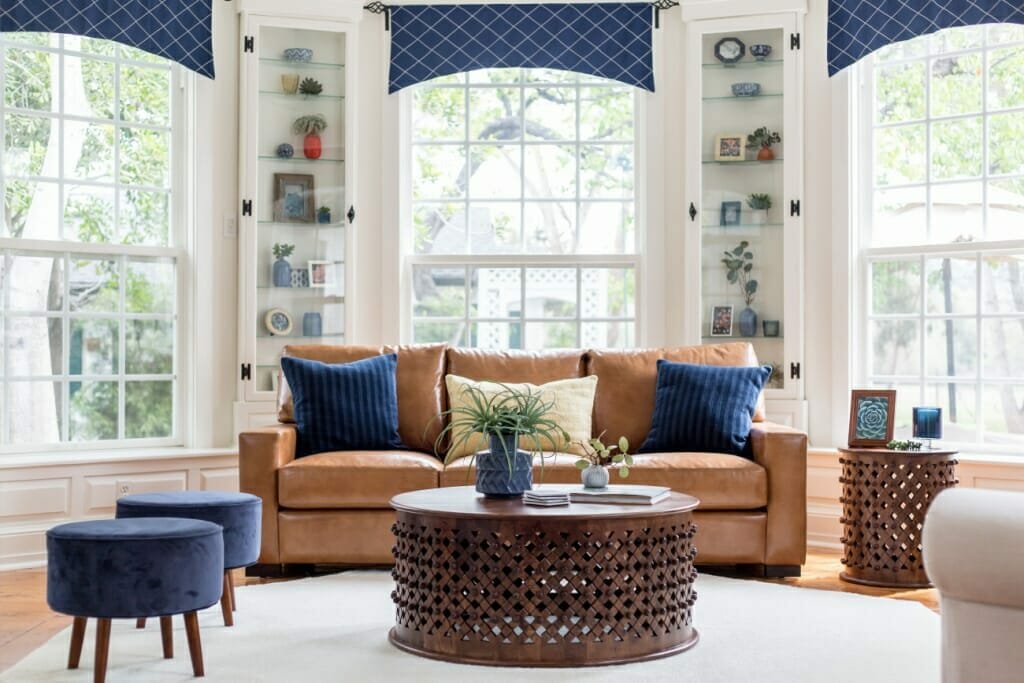 A one-point perspective interior photography shot of a bright and airy living room