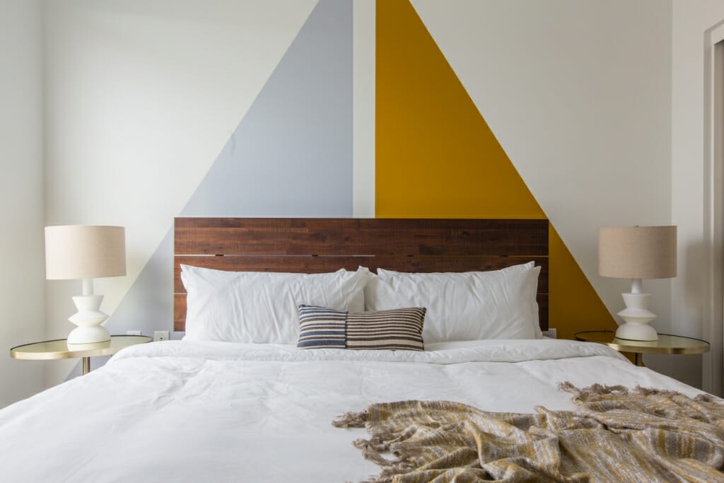 An interior photography image of a luxury, minimalist bedroom