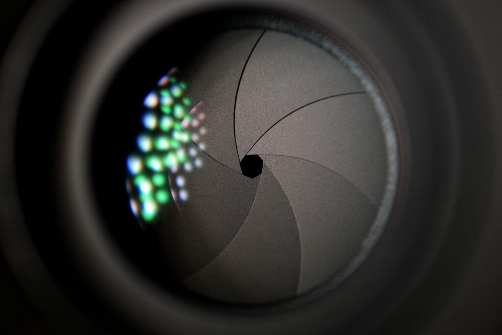 A photo of a camera lens showing a small aperture