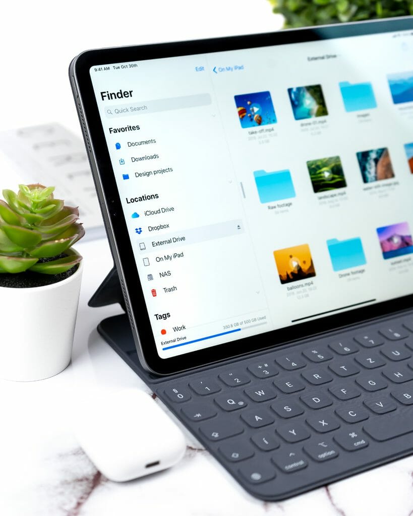 A tablet screen and keyboard showing file folders