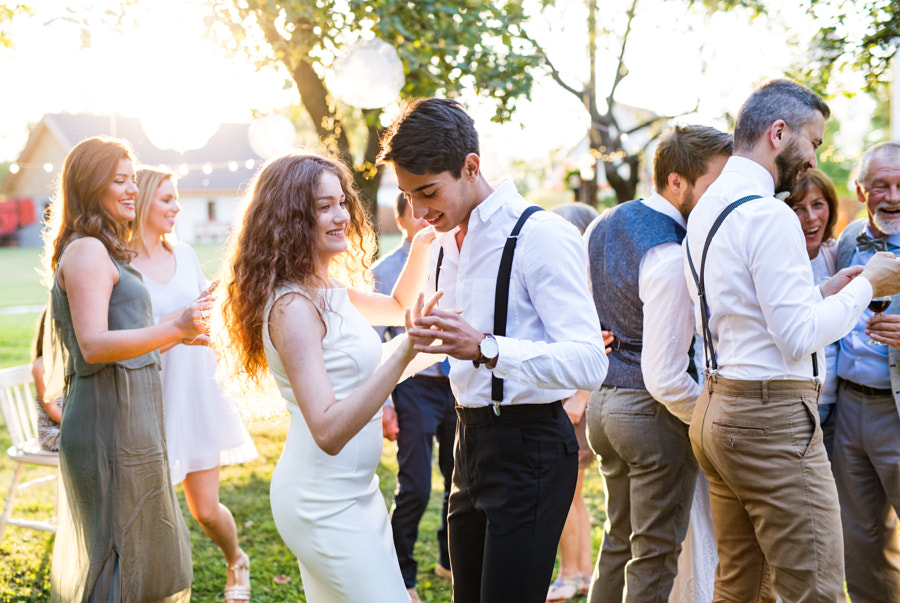 Wedding photography - Guests dancing at wedding reception outside in the backyard. by Jozef Polc on 500px.com