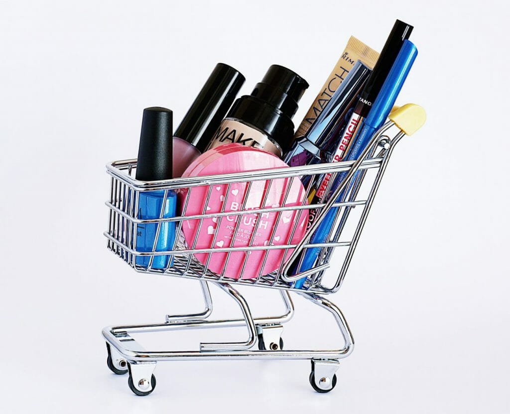 A mini shopping cart full of make-up products
