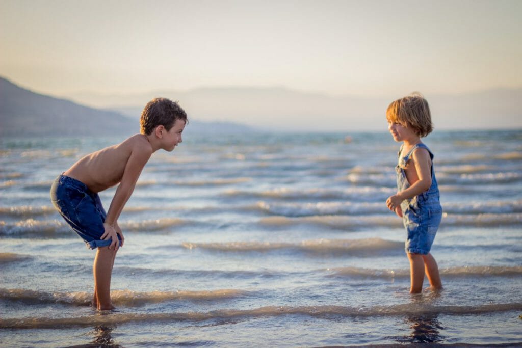 Two  children playing in the beach