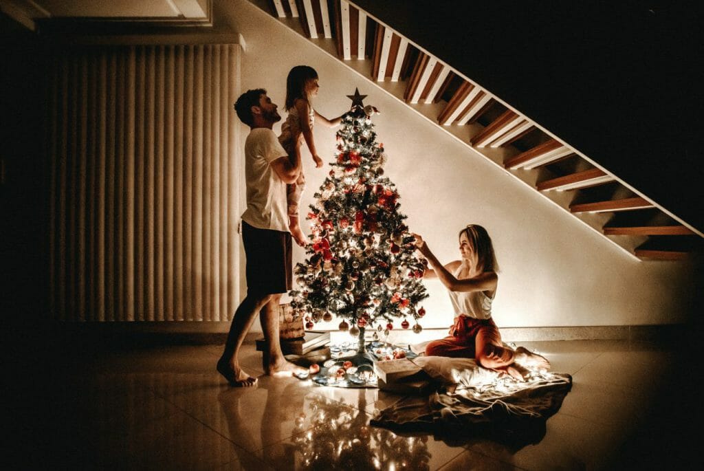 A family of three posing for a candid family photography session.