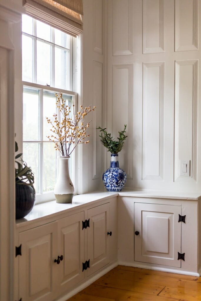 An indoor photography shot of vases on a windowsill