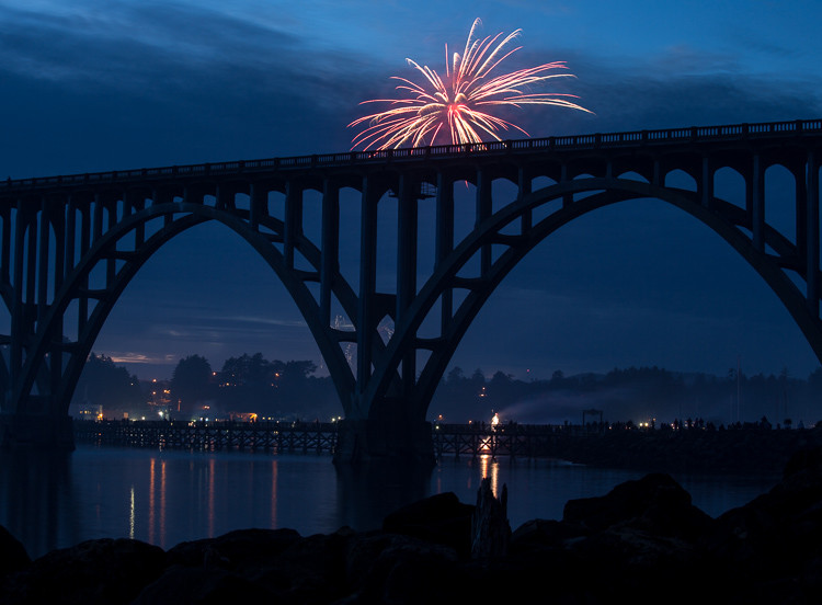 fireworks bursting too low and obstructed by bridge in the foreground