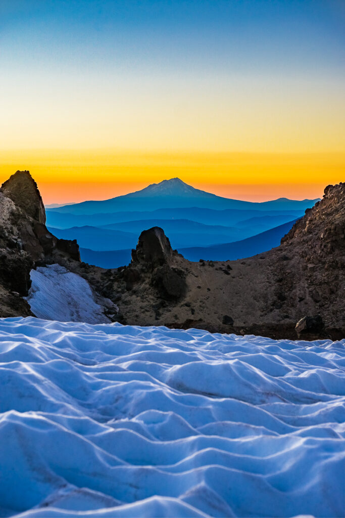 vertical photo of mountains and ice during golden hour sunset for a very creative mountain photography