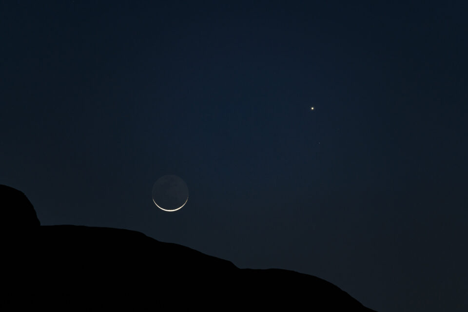 Crescent moon and Venus with some foreground