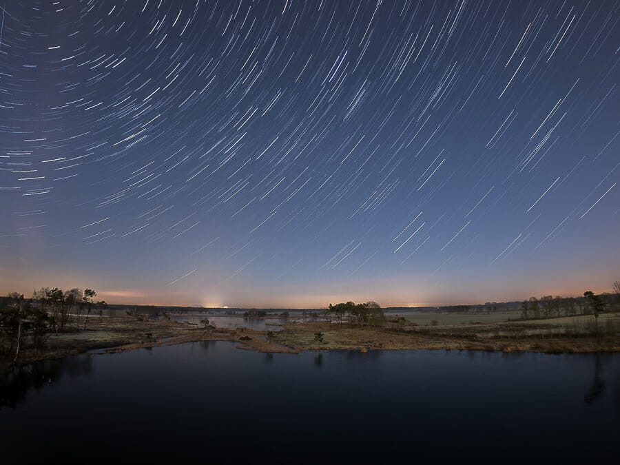 A night landscape image showing star trails