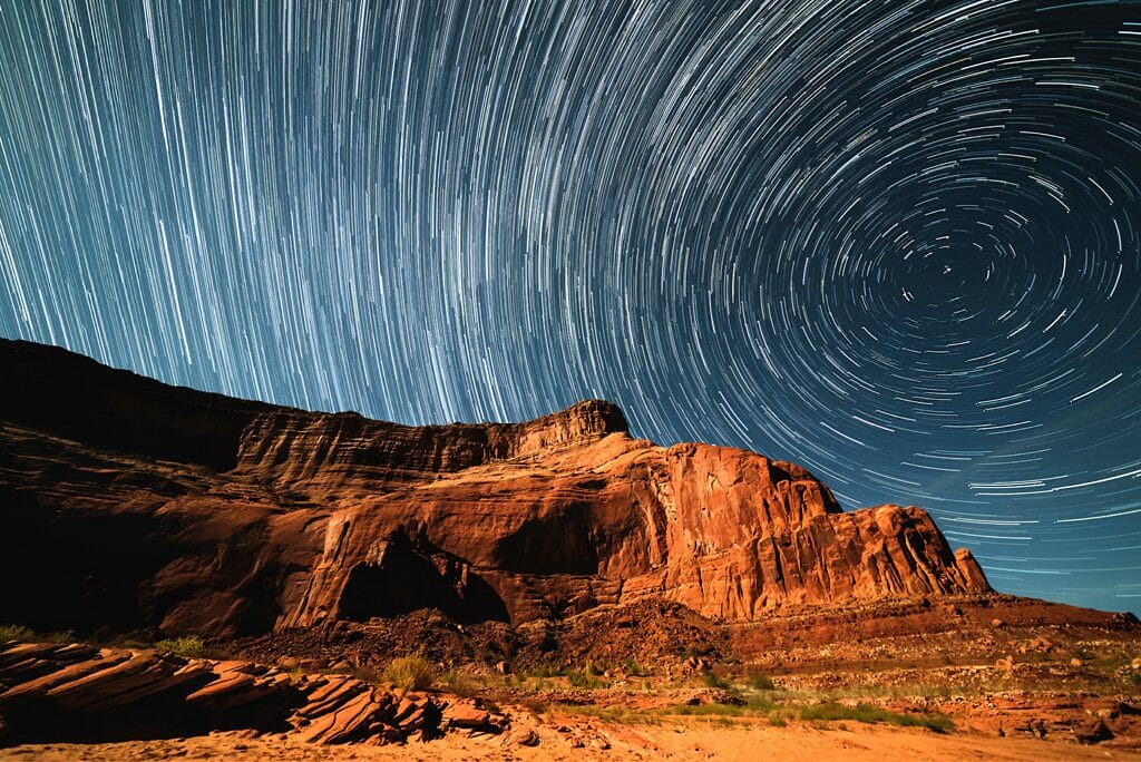 Star trails over canyon rocks