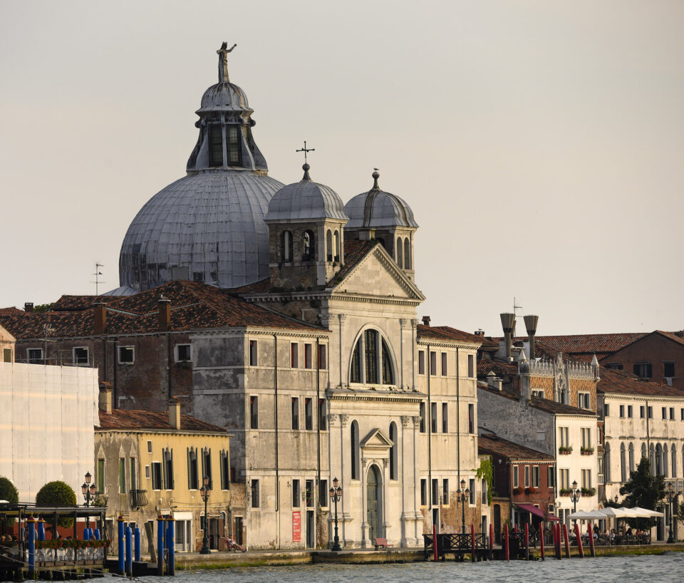 Evening sun catches the façade of the church of Le Zitelle