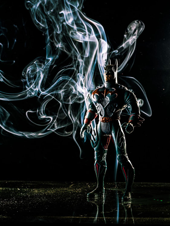 batman action figure enhanced with background smoke trails for a very creative photo