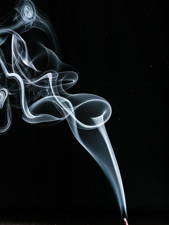 disturbing the air with your hand results in a more creative photo of the smoke