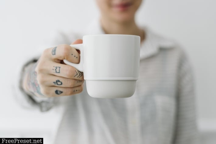 Woman having a cup coffee mockup