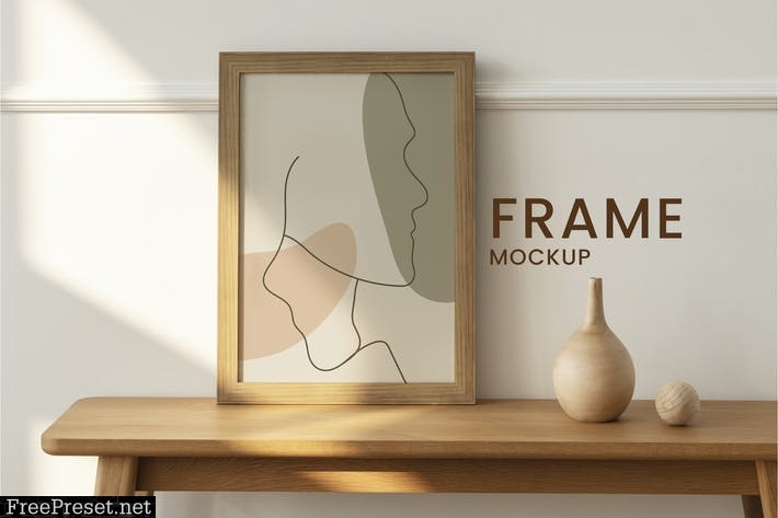 Wooden picture frame mockup on a wooden table